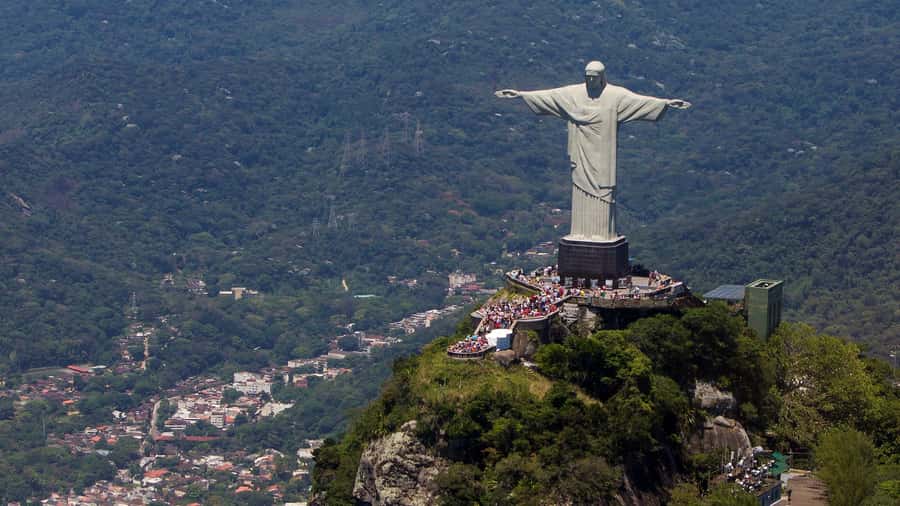 Rio: Christ The Redeemer Half Day Tour With Pick up - Reaching Christ the Redeemer by van or train