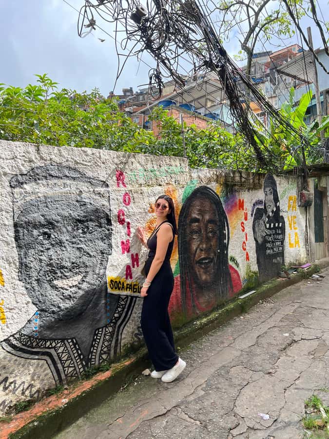 Rio: Favela Rocinha Tour with Local Guide & Secret Spots - Walking downhill through homes, shops, and local projects