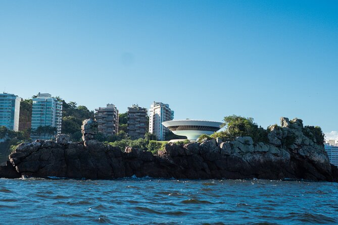 Sunset Boat Tour with Beer, Water, Soda and Snacks included - An hour at Adão e Eva Beach